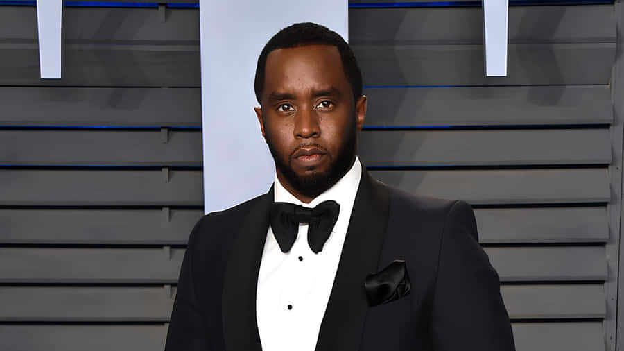 Diddy In Classic Black Tuxedo Wallpaper