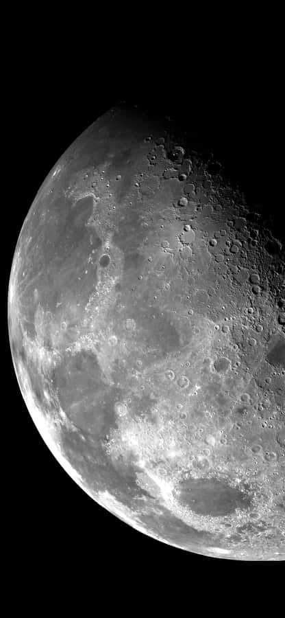 Enjoy A Serene Evening With A Moonlit View From Your Iphone Wallpaper