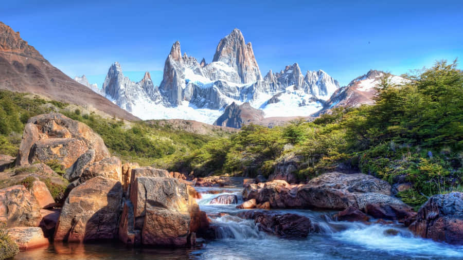 Enjoy The Beauty Of The Majestic Mountains Wallpaper