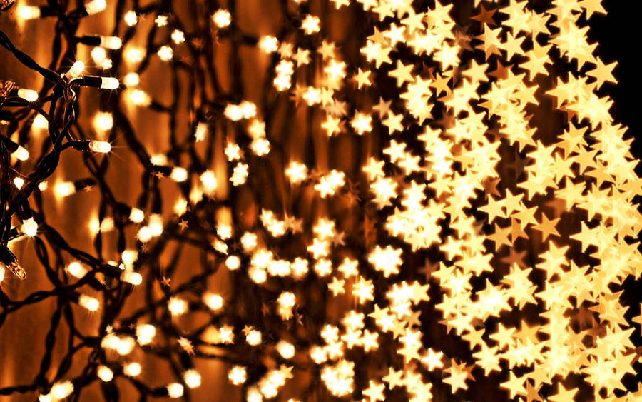 Enjoy The Festive Glow Of Christmas Lights Wallpaper