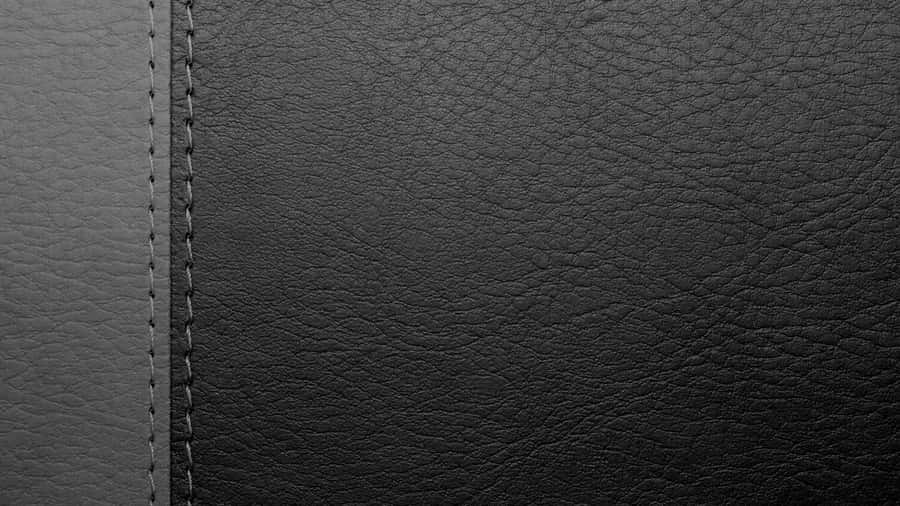 Enjoy The Luxury Of Black Leather. Wallpaper