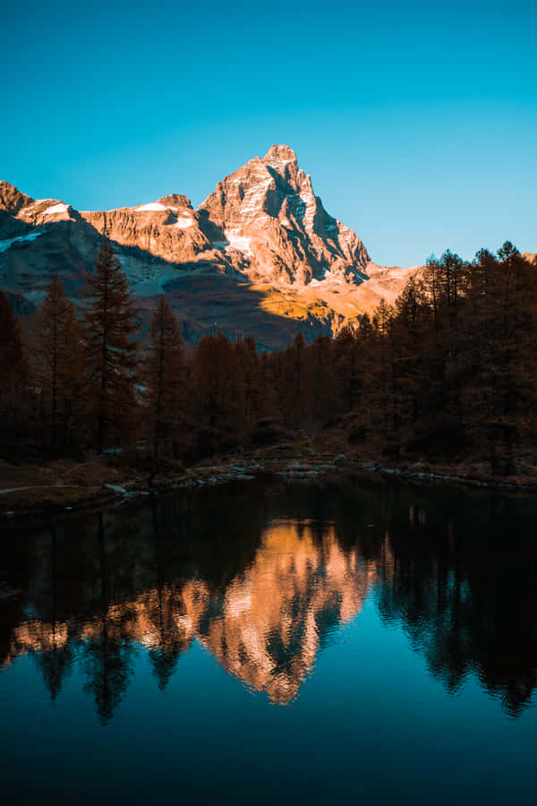 Enjoy The Majesty Of Nature While Exploring A Mountain Range. Wallpaper