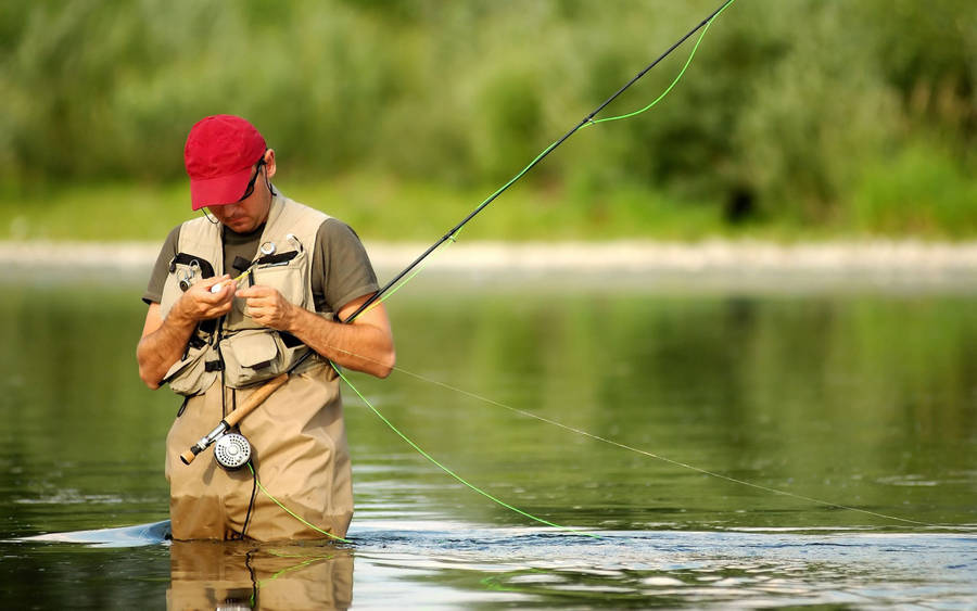 Enjoying An Afternoon Of Bass Fishing In The Lake Wallpaper