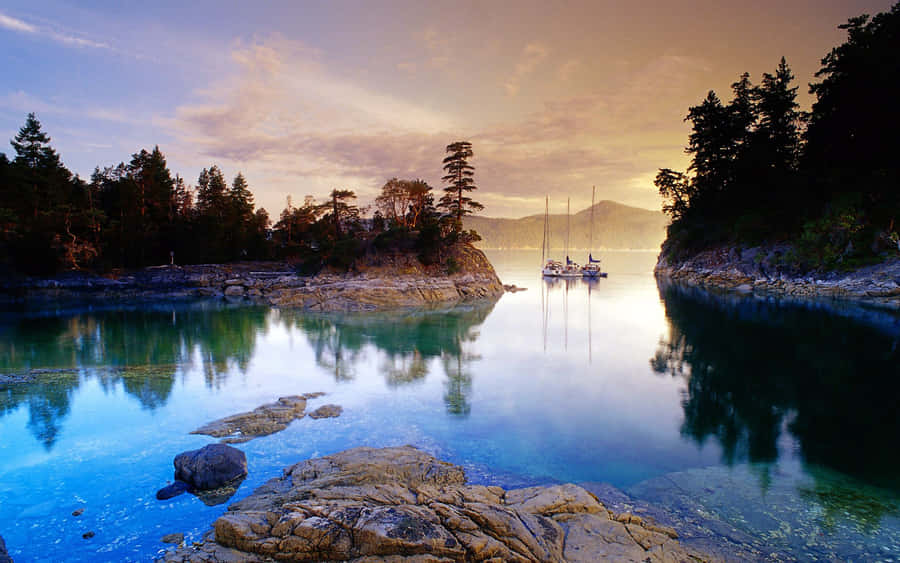 Enjoying The Tranquility Of A Beautiful Lake. Wallpaper