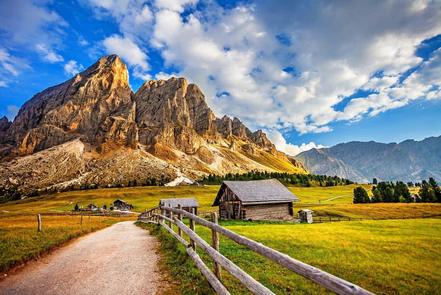 Explore The Beauty Of A Majestic Mountain Scape Wallpaper
