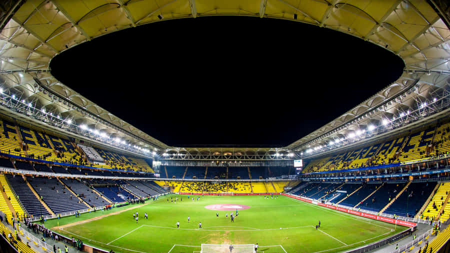 Fans Cheering In Excitement For Their Team At Soccer Stadium Wallpaper