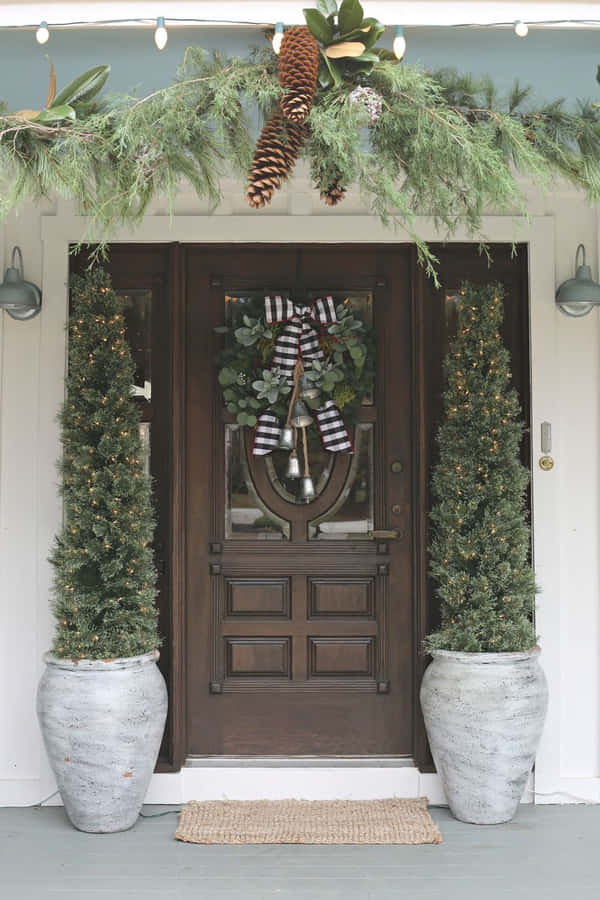 Farmhouse Christmas House With Plants In Vases Wallpaper