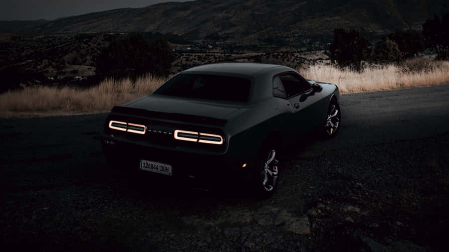 Feel The Thrill Of The Open Road In A Dodge Challenger Wallpaper