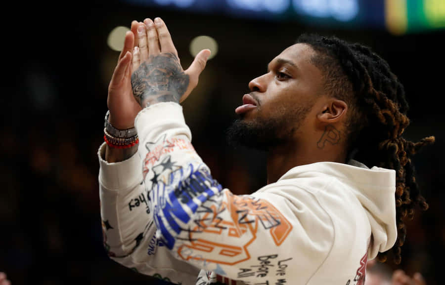 Football Player Celebratory Gesture Wallpaper