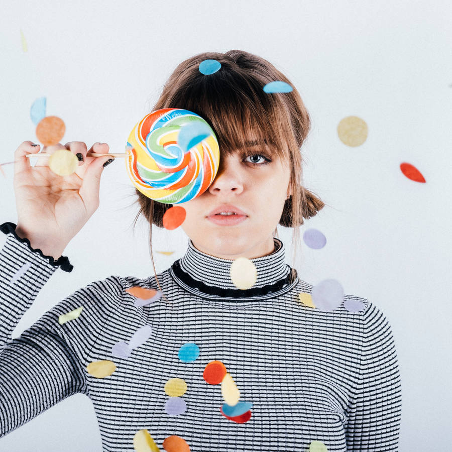 Girl With Swirly Candy Wallpaper