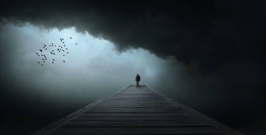 Gloomy Black Clouds Forming A Sad Face Wallpaper