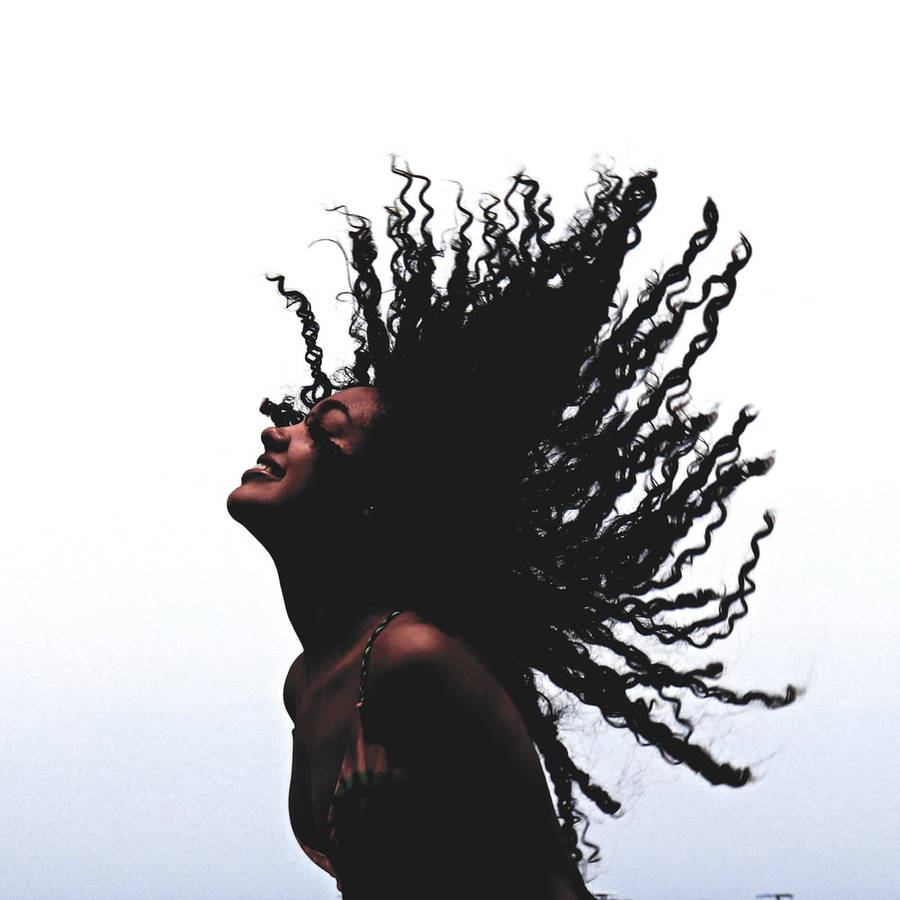 Graceful Ebony Beauty Hair Flip Wallpaper