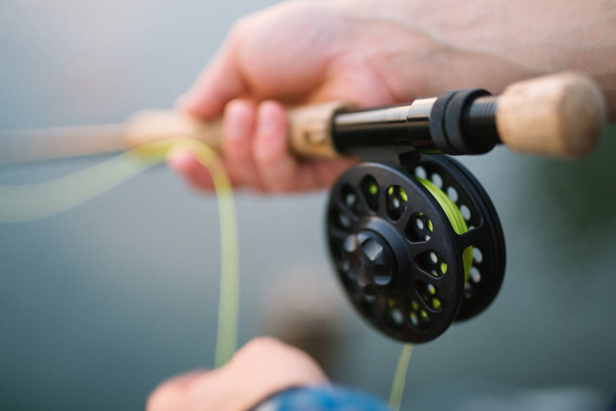 Handheld Fishing Rod Wallpaper