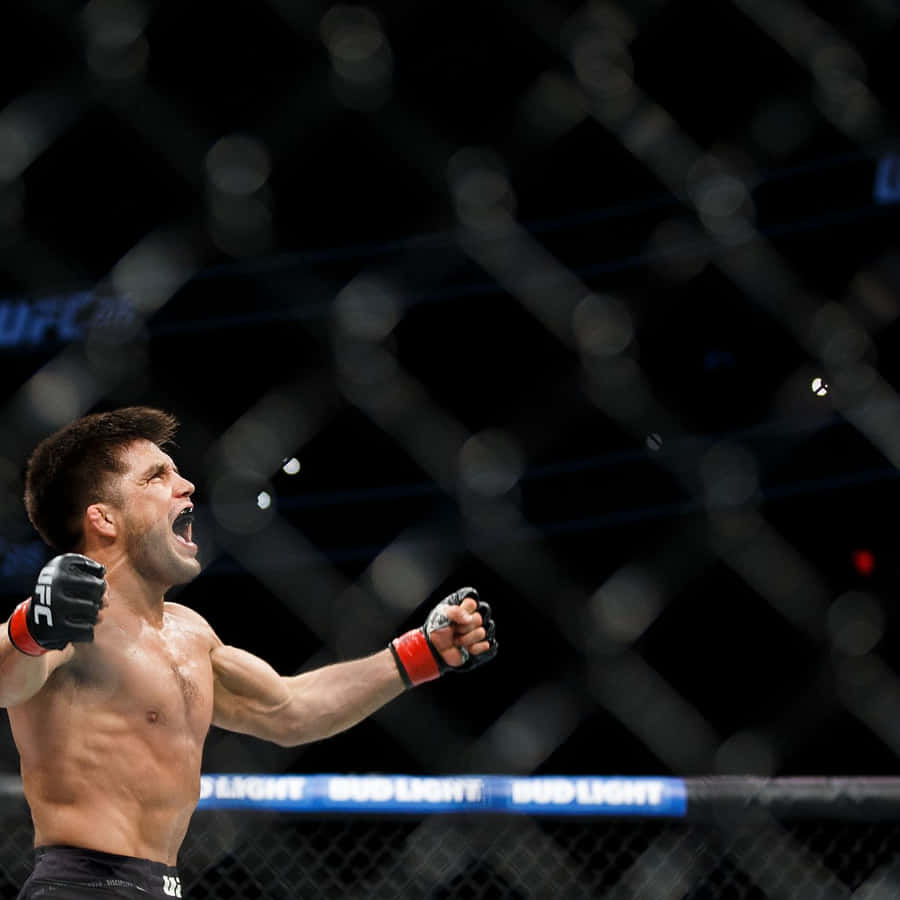 Henry Cejudo Celebrating Victory Over Tj Dillashaw Wallpaper
