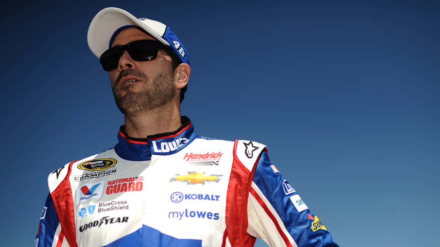 Jimmie Johnson Racing In His Iconic #48 Car On The Track Wallpaper