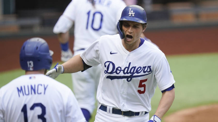 Los Angeles Dodgers Star Corey Seager Celebrating With Max Muncy Wallpaper