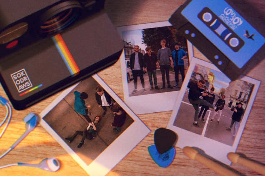 Love Joy Cassette Tape And Polaroid Photographs Wallpaper