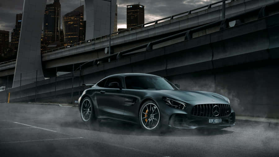 Luxury Mercedes Black Sitting Majestically In The Showroom Wallpaper