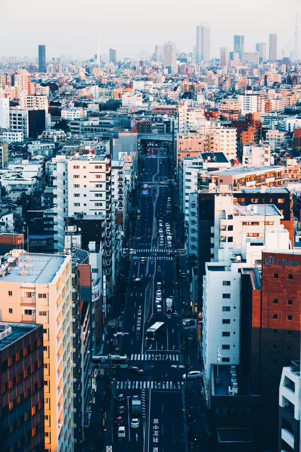 Many Fashionable Young People Gather At The Iconic Harajuku District In Tokyo Wallpaper