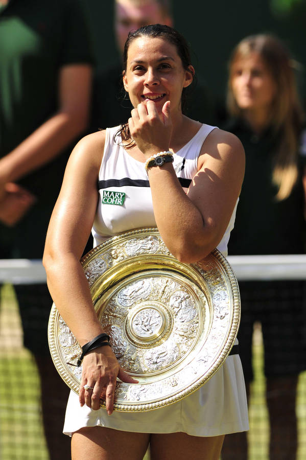 Download Free Marion Bartoli Triumphantly Holding Wimbledon Trophy Download Free Marion Bartoli Triumphantly Holding Wimbledon Trophy