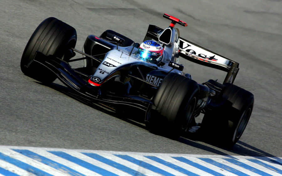 Mclaren Formula 1 Team Leading The Race Wallpaper