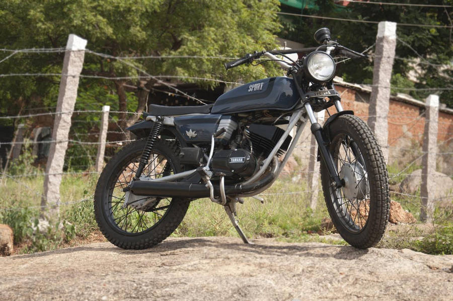 Parked Black Yamaha Rx100 Tracker Wallpaper