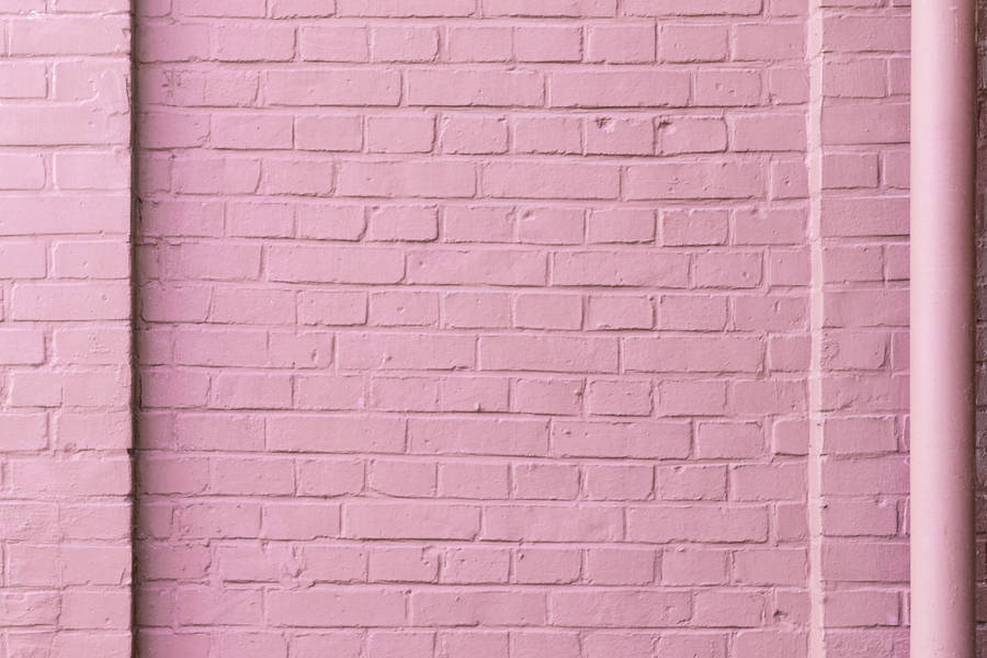 Pink brick wall wallpaper