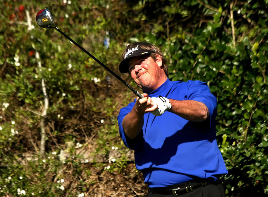 Professional Golfer Steve Lowery Preparing For A Shot Wallpaper
