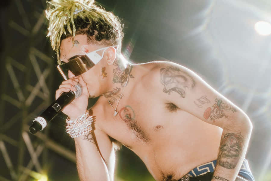 Rapper Lil Pump Performing Onstage Wallpaper