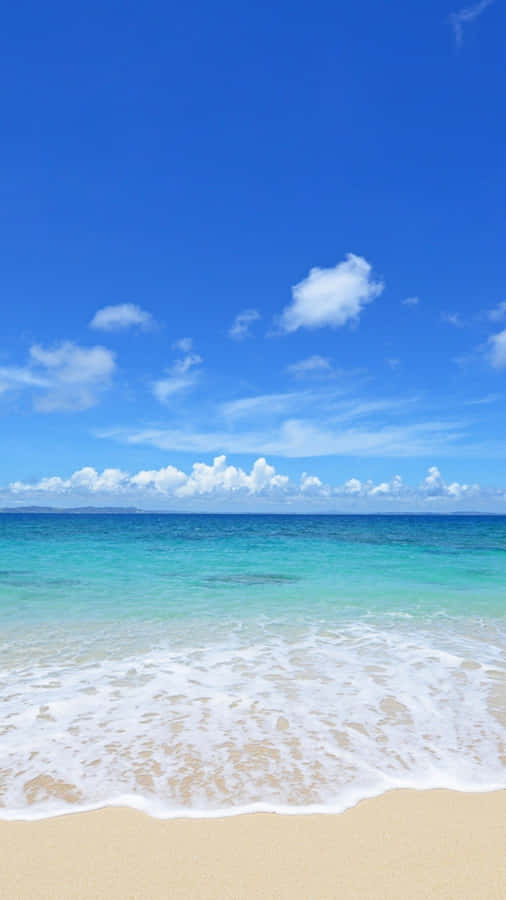 Relax, Unwind And Enjoy The Natural Beauty Of Summer At The Beach Wallpaper