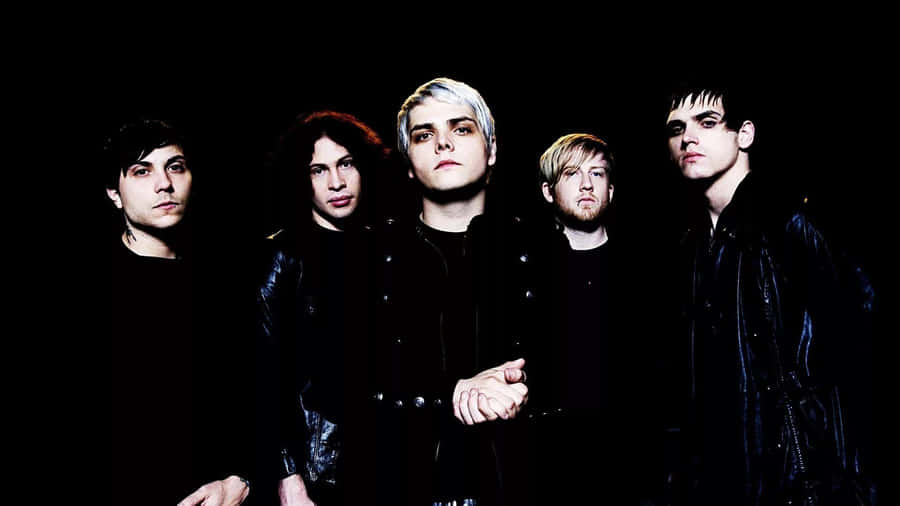 Rock_ Band_in_ Black_ Attire_ Group_ Photo Wallpaper