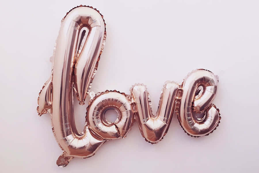 Rose Gold Inflated Text Laptop Wallpaper