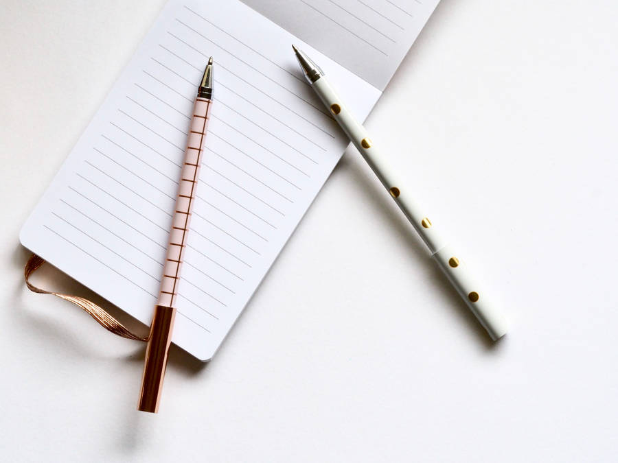 Rose Gold Pens On Notebook Wallpaper
