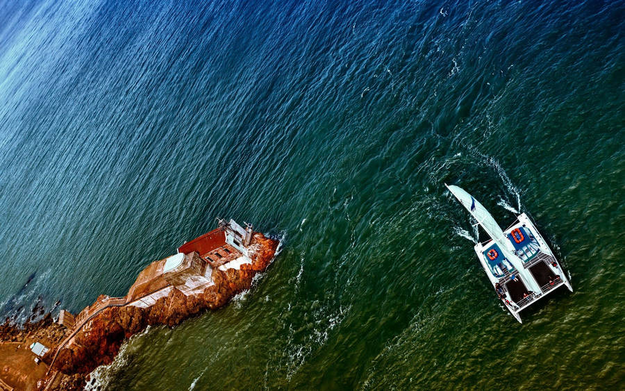Sailing Near Lime Point Lighthouse Wallpaper