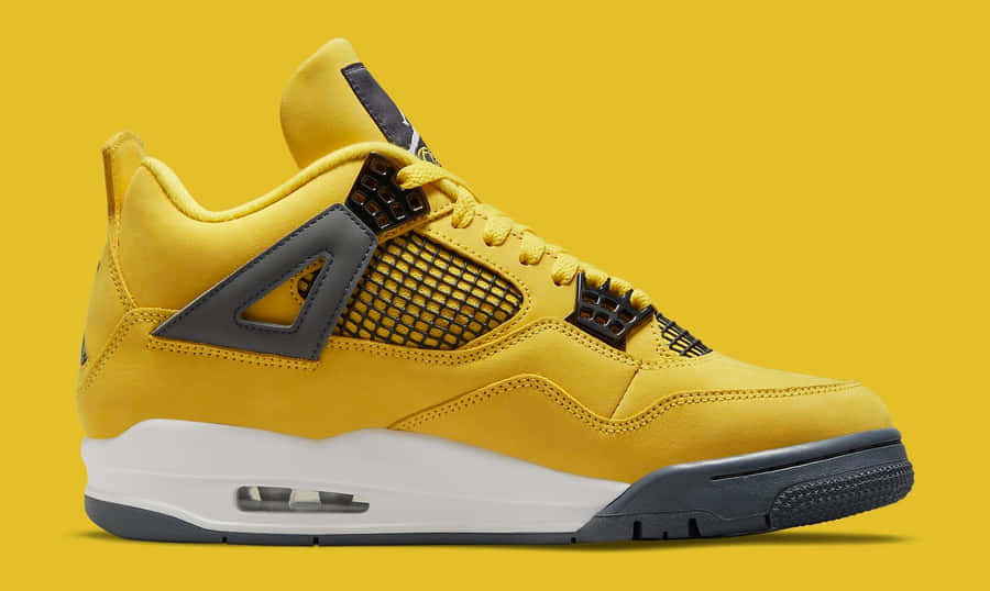 Show Your Support For The Jumpman With The Yellow Jordan Wallpaper