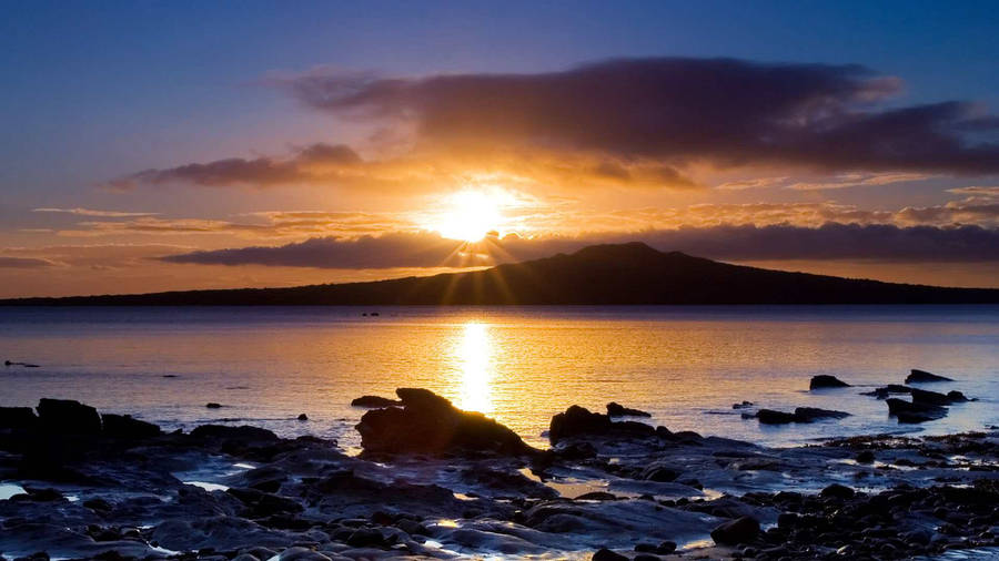 Soak Up The Breathtaking Beauty Of An Ocean Sunset Wallpaper