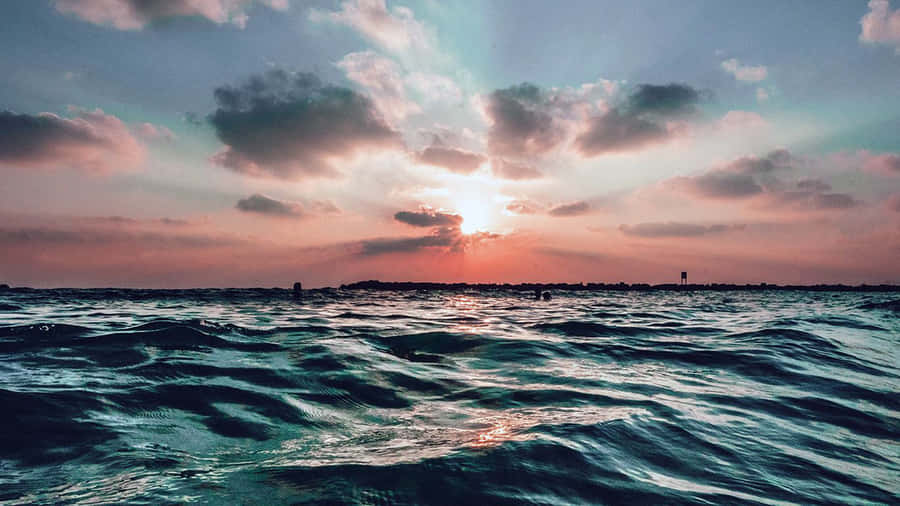 “soaking Up The Sunrise In The Pretty Ocean” Wallpaper