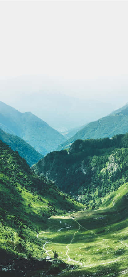 Standing On The Mountain And Looking At The Vastness Of The Horizon. Wallpaper