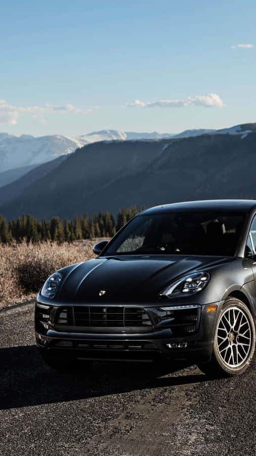 Stunning Black Porsche On City Street Wallpaper