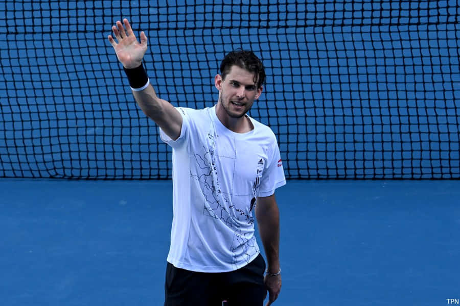 Tennis Player Wavingon Court Wallpaper
