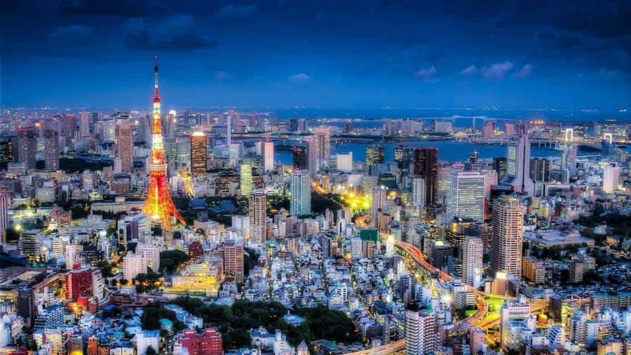 Tokyo City At Night With The Taito Tower Wallpaper