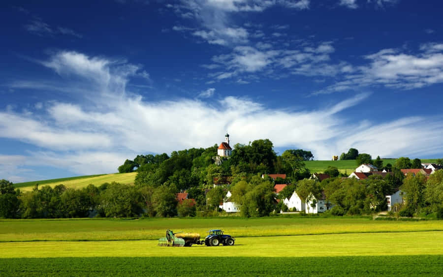 Tractor With A Farmhouse Desktop Wallpaper