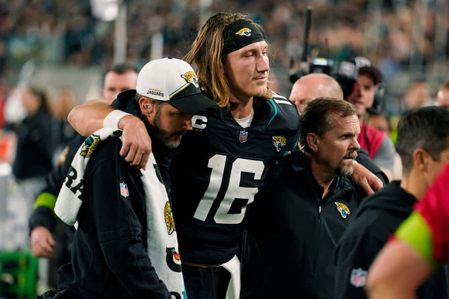 Trevor Lawrence Injured Assisted Off Field Wallpaper