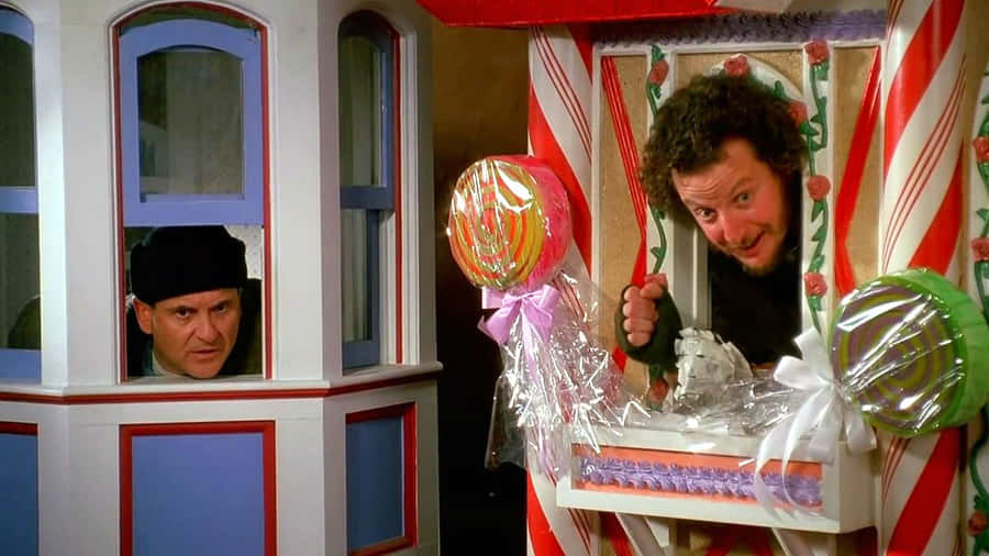 Two Men In A Candy Cane House Wallpaper