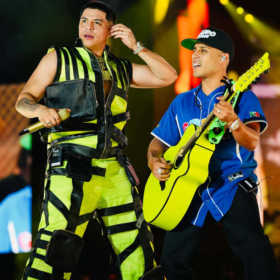 Two Men In Yellow Outfits Wallpaper