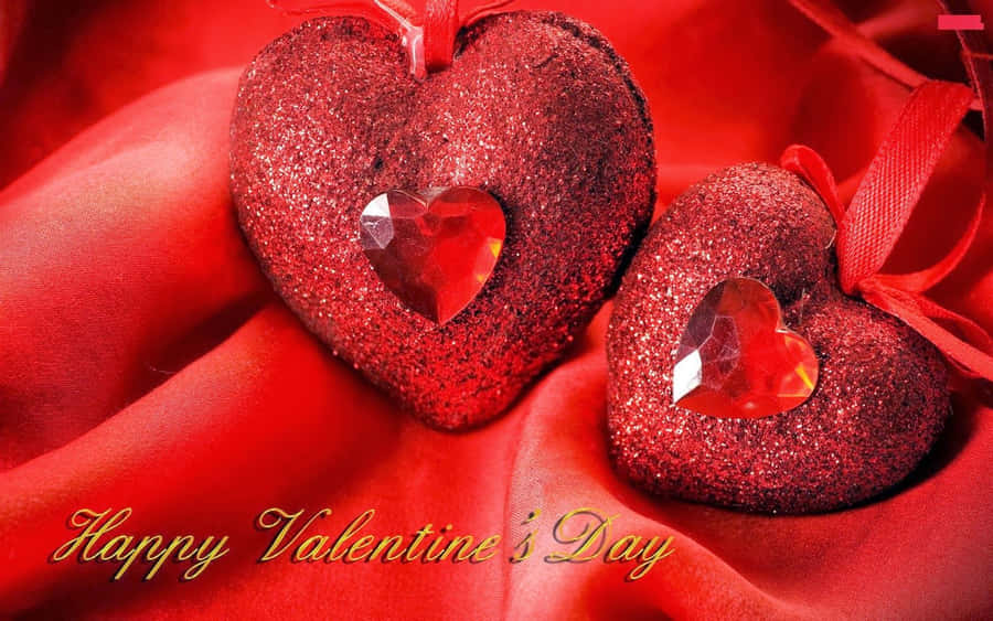 Two Red Hearts With Happy Valentine's Day Written On Them Wallpaper