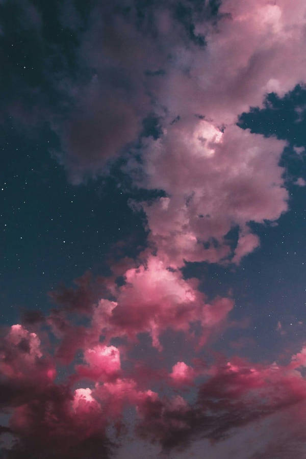Vast Depths Of A Beautiful Purple Sunset Over The Clouds Wallpaper