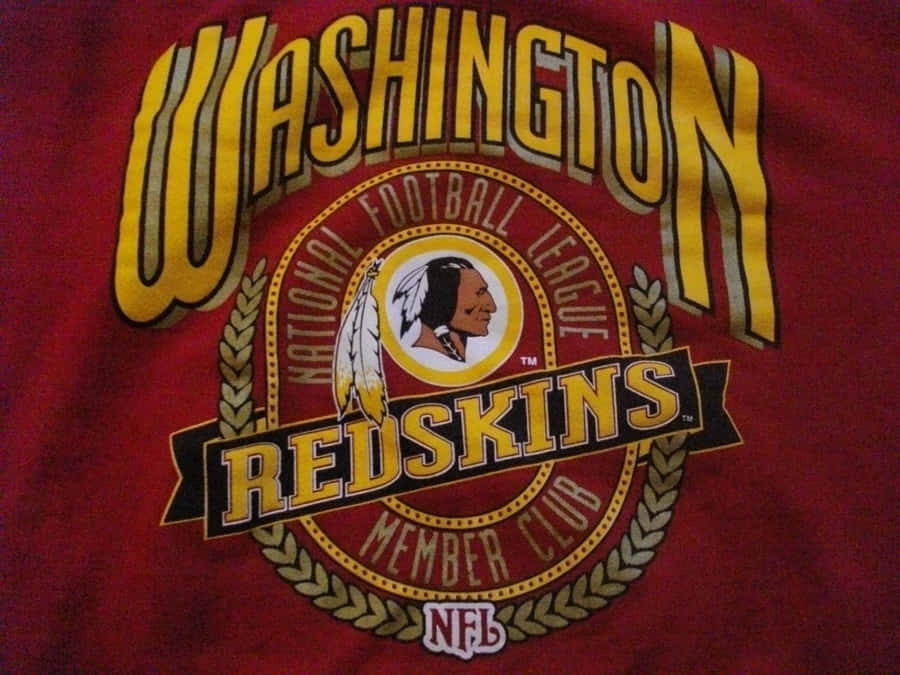 Washington Football Team Players In Action During A Thrilling Game Wallpaper