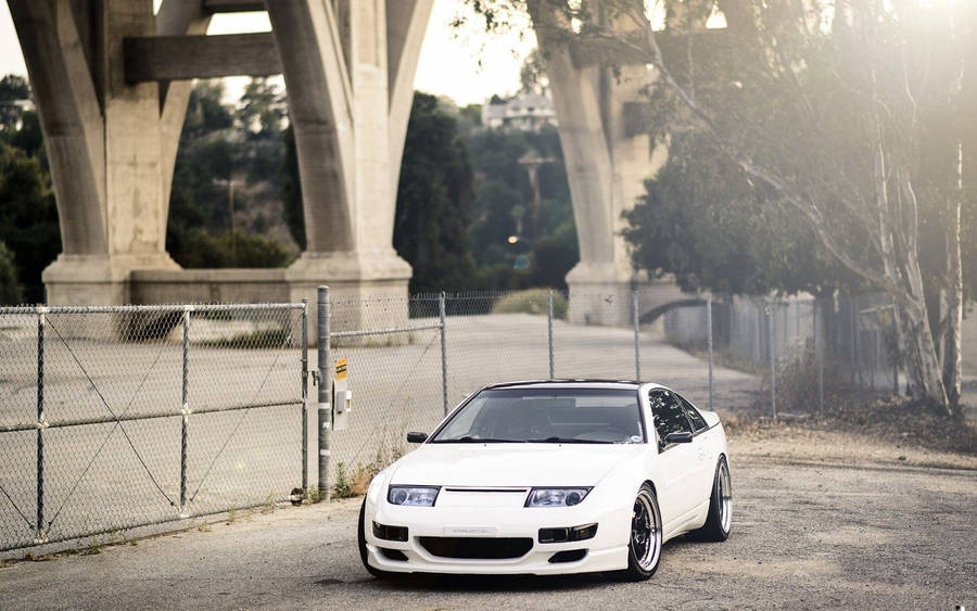 White Nissan In City Wallpaper