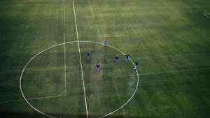 2560x1440 Soccer Men Playing Wallpaper